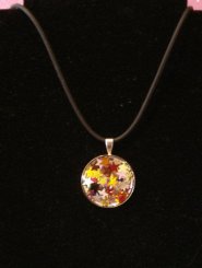 Round Silver Pendant filled with metallic coloured stars